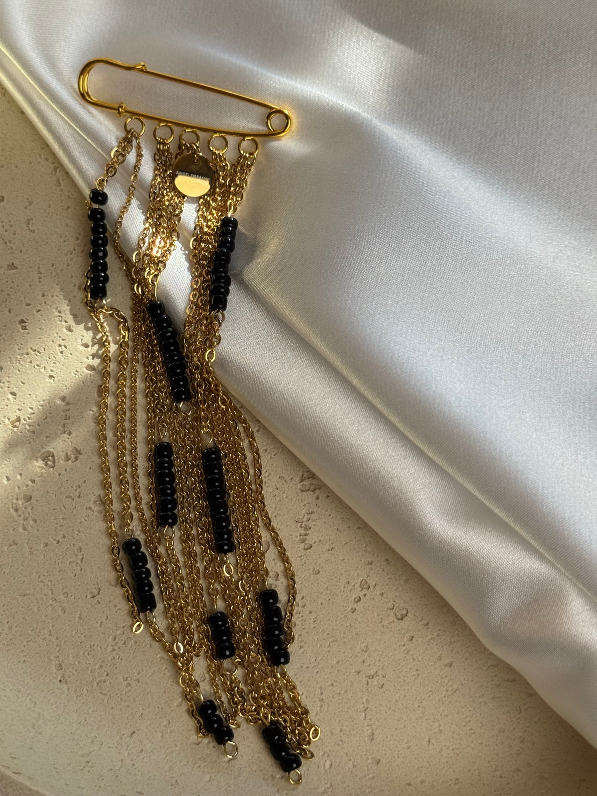 Gold-Tone Chain Brooch with Black Beads