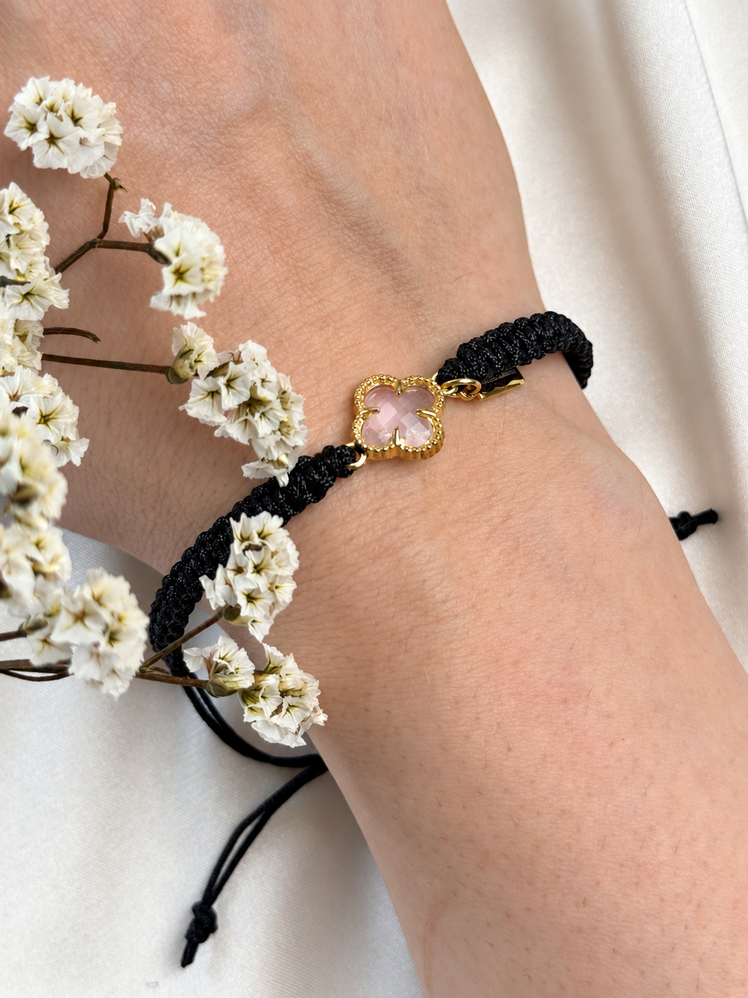 Blush Clover Bracelet

A handmade macramé bracelet featuring black knotted cord and a faceted blush-pink clover centrepiece framed in gold-tone detailing. The contrast of soft pink and black adds an elegant touch, while the centrepiece catches the light with a delicate sparkle.

Beautiful worn alone or layered with your favourite bracelets.

Fit: Adjustable with a sliding knot closure.