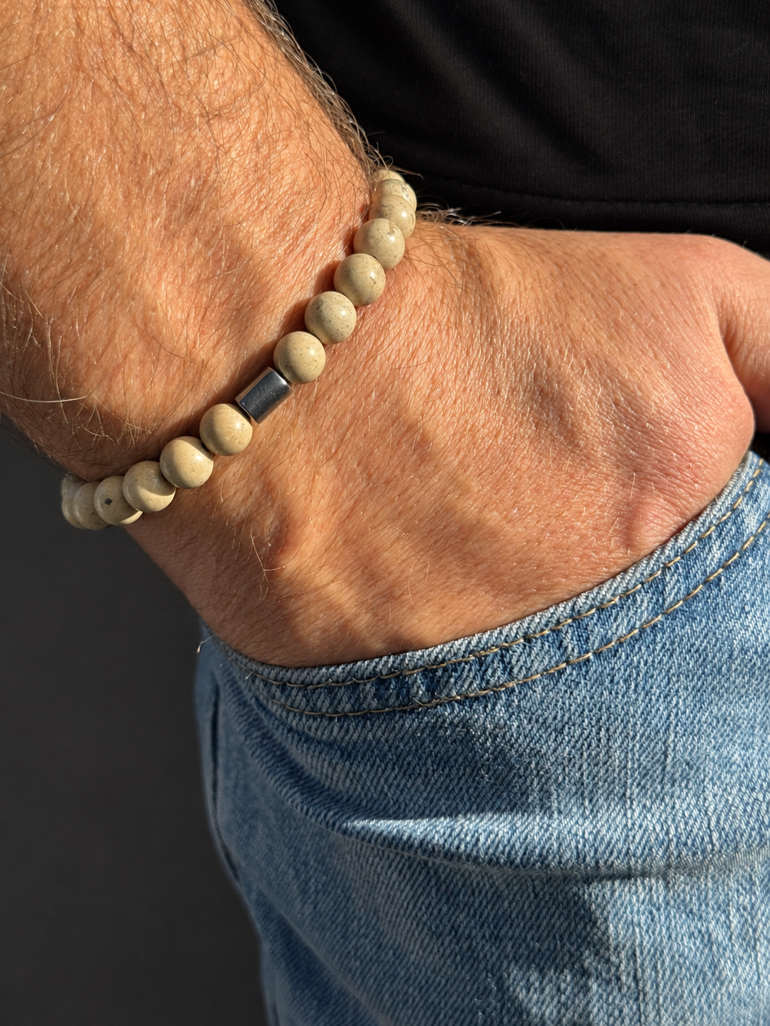 A handmade bracelet featuring stone in warm beige tones and a distinctive rectangular hematite accent. A minimalist, earthy design, perfect worn alone or stacked with other bracelets.

Stone size: 8 mm
Bracelet size: approximately 18–18.5 cm