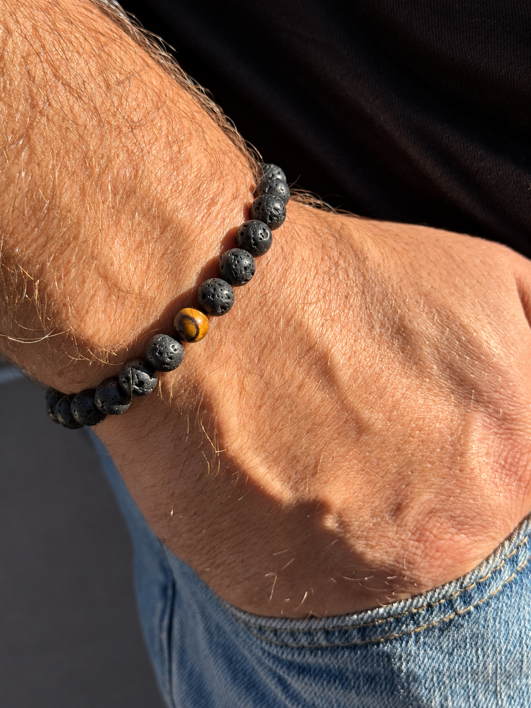 A handmade bracelet featuring textured lava stone and a brown tiger’s eye accent with warm golden tones. A minimalist design, perfect worn alone or stacked with other bracelets.

Stone size: 8 mm
Bracelet size: approximately 18–18.5 cm